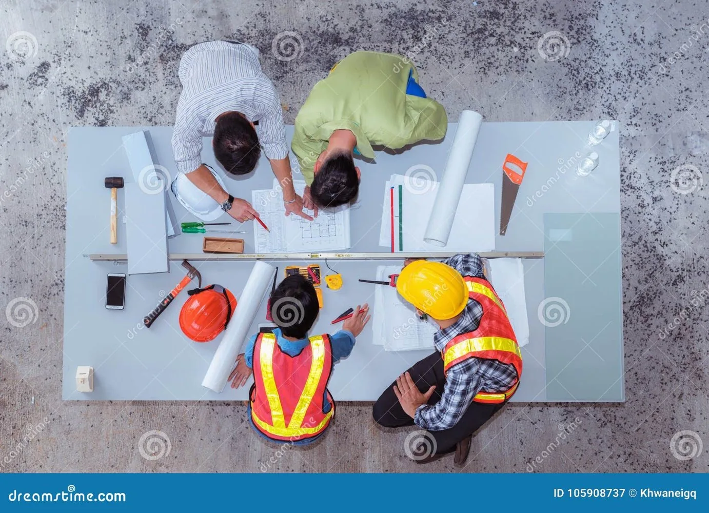 Construction professionals reviewing project plans together